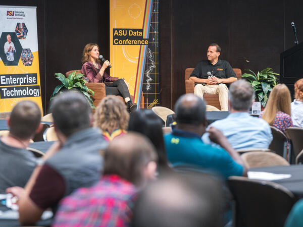 2023 Data Conference participants listening to keynote speaker Kate Valenti, co-CEO of Unicon