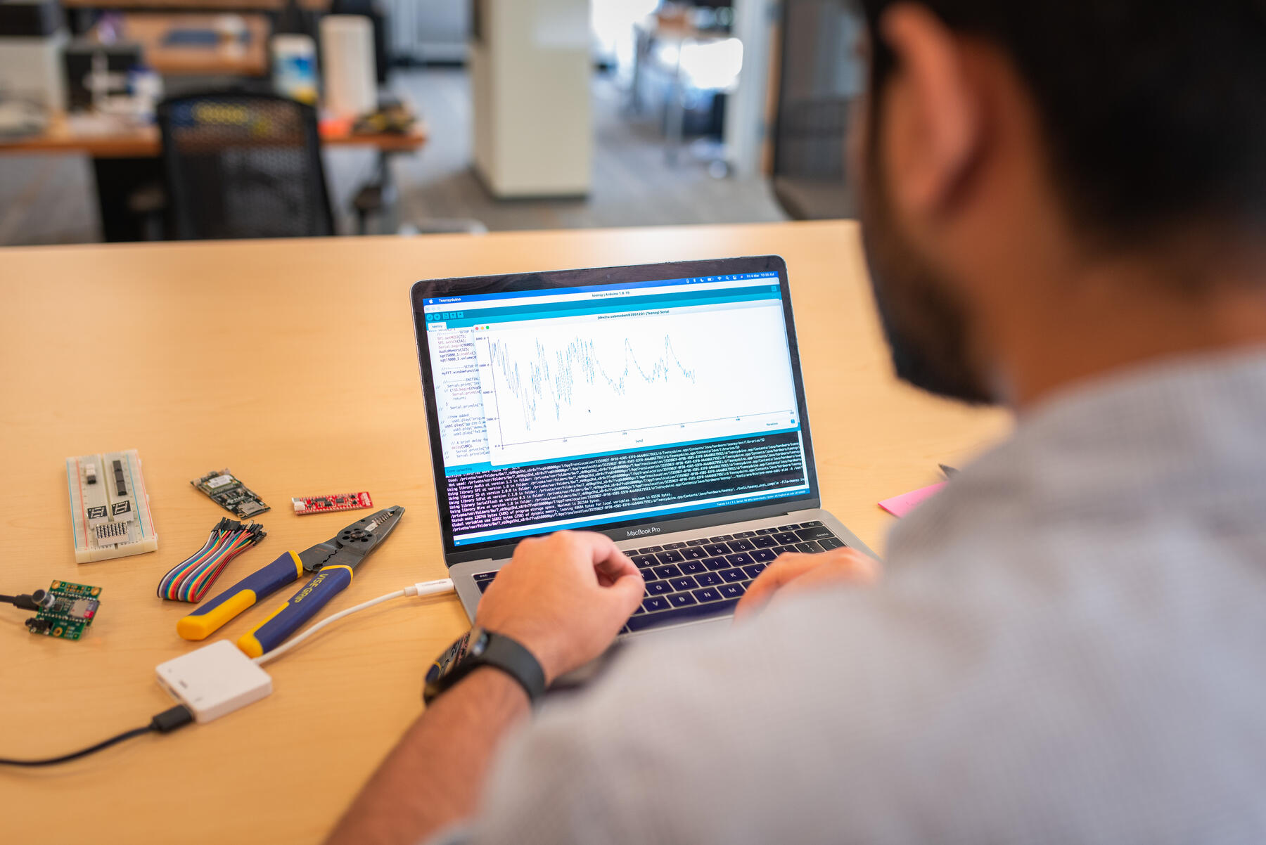 ASU student and intern for the Cloud Innovation Center working on a project.